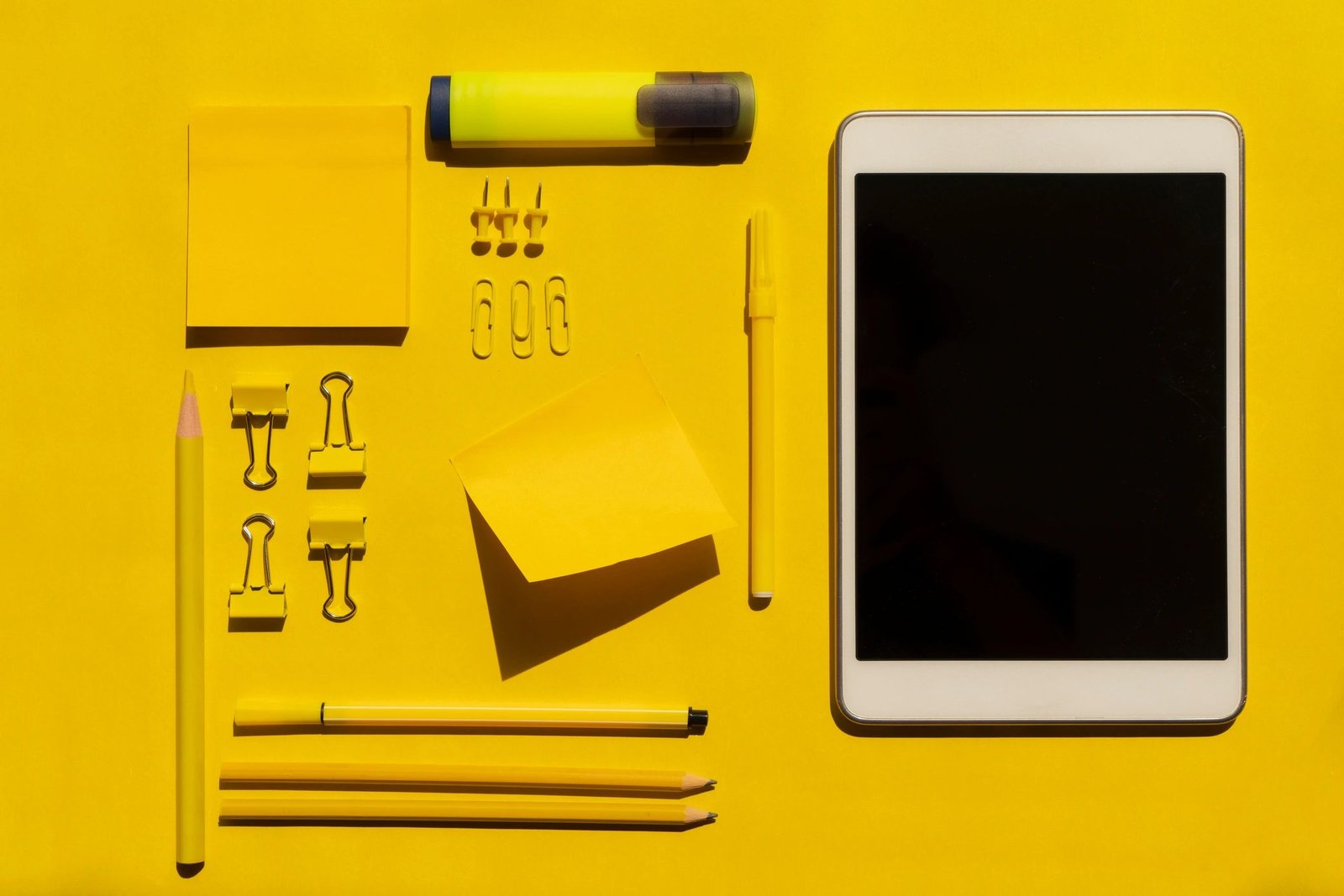 Yellow stationery on a yellow background