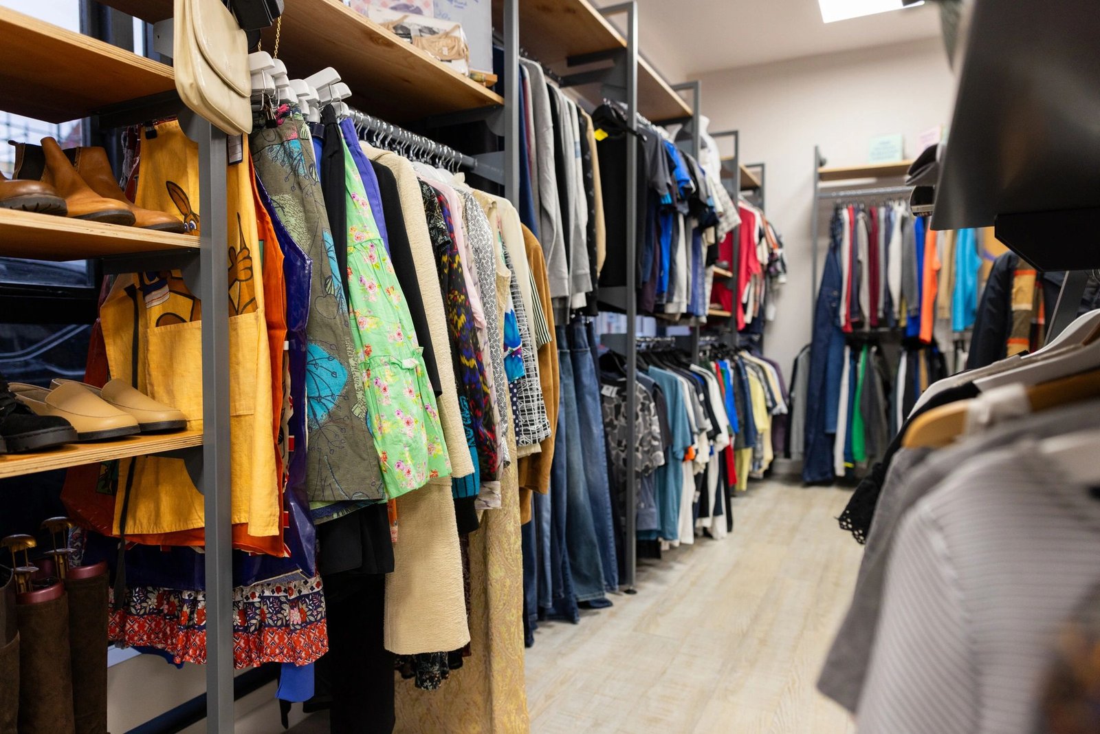 Interior of a charity shop with clothing racks
