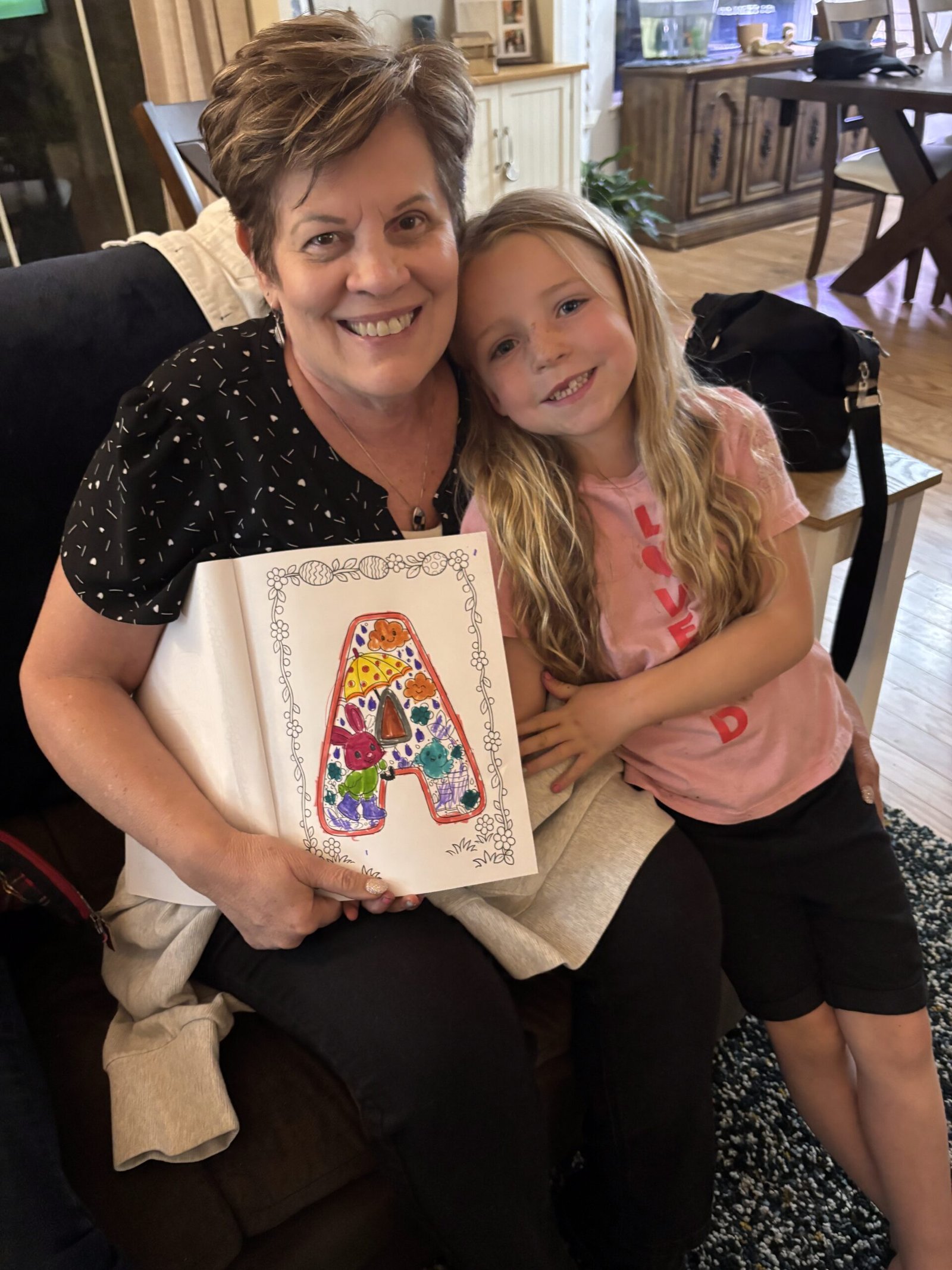 Grandma and Granddaughter with Coloring Book